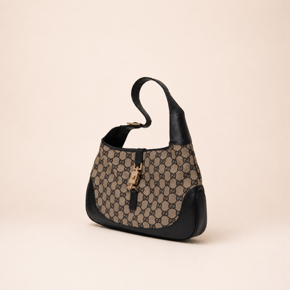 Authentic vintage Gucci Jackie O handbag in beige GG canvas with black leather trim and gold-tone hardware