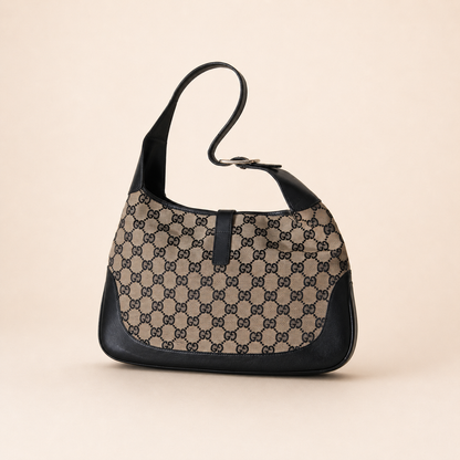 Authentic vintage Gucci Jackie O handbag in beige GG canvas with black leather trim and gold-tone hardware