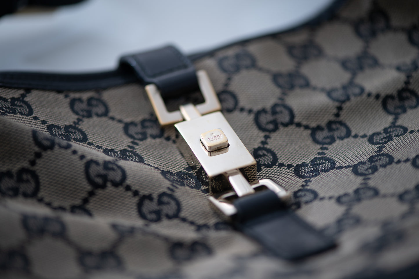 Authentic vintage Gucci Jackie O handbag in beige GG canvas with black leather trim and gold-tone hardware