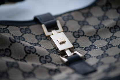 Authentic vintage Gucci Jackie O handbag in beige GG canvas with black leather trim and gold-tone hardware