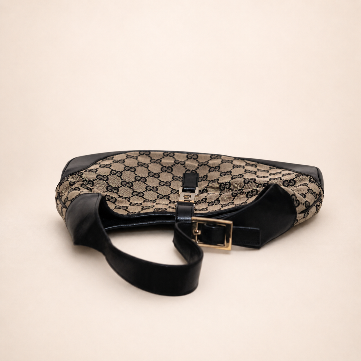 Authentic vintage Gucci Jackie O handbag in beige GG canvas with black leather trim and gold-tone hardware