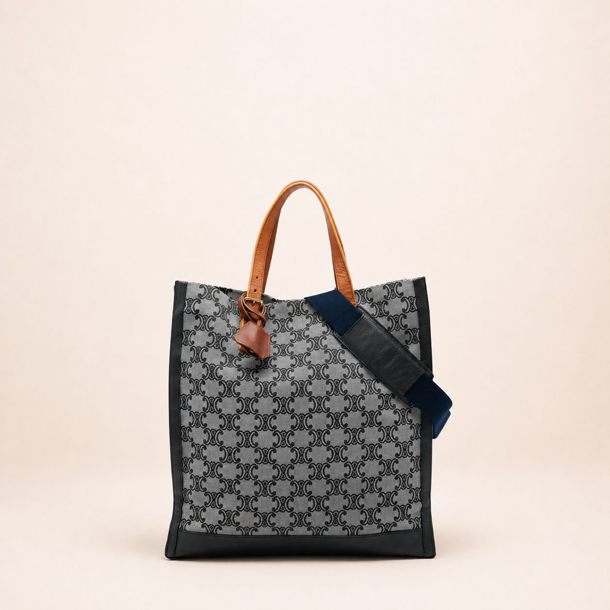 Authentic vintage Céline Triomphe Vertical Tote bag in grey Triomphe canvas with leather trim, tan leather handles and a detachable shoulder strap.