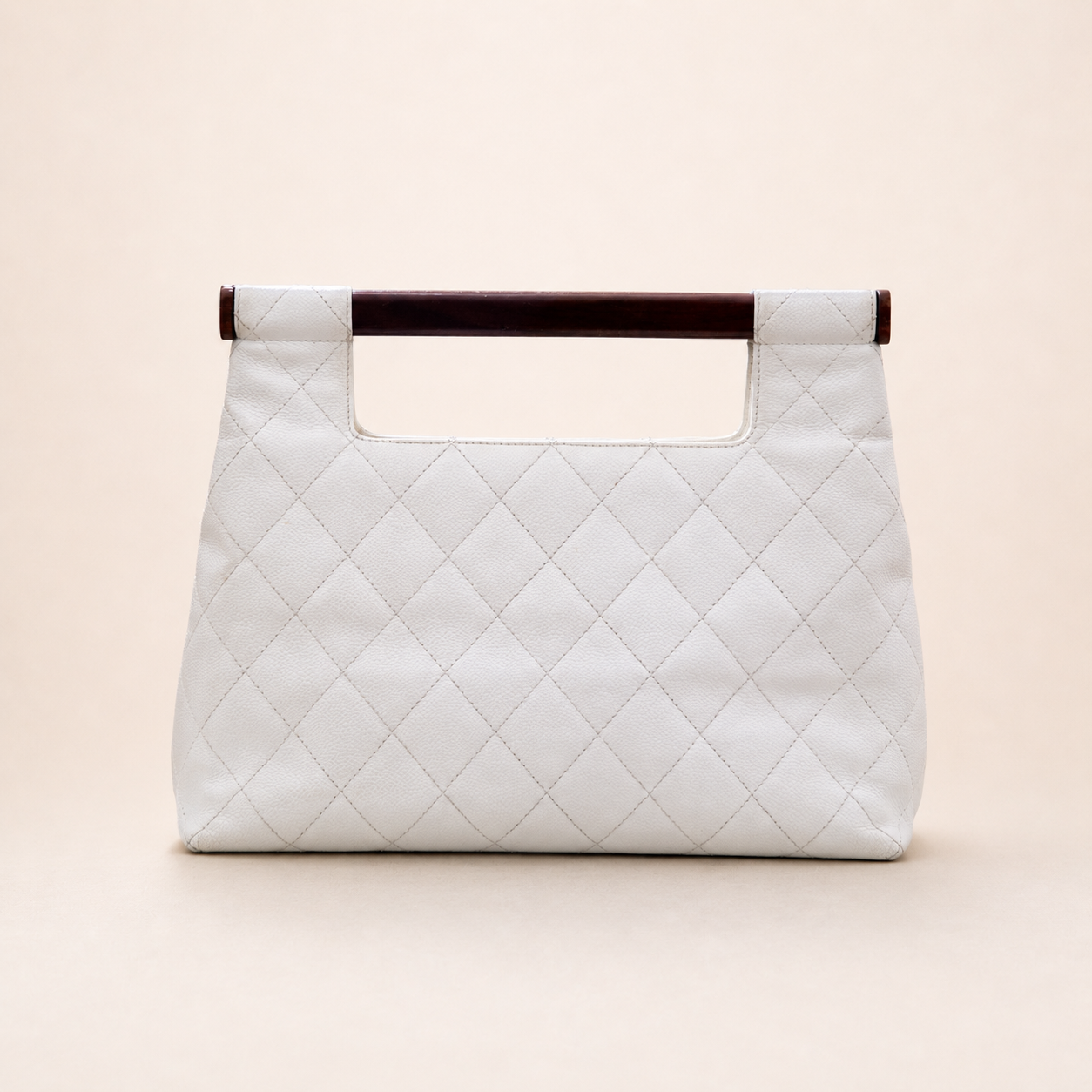 Rare authentic Chanel White Caviar Leather Wood Handle Bag with Matelassé quilting and gold-tone CC logo.