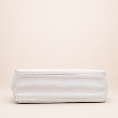 Rare authentic Chanel White Caviar Leather Wood Handle Bag with Matelassé quilting and gold-tone CC logo.