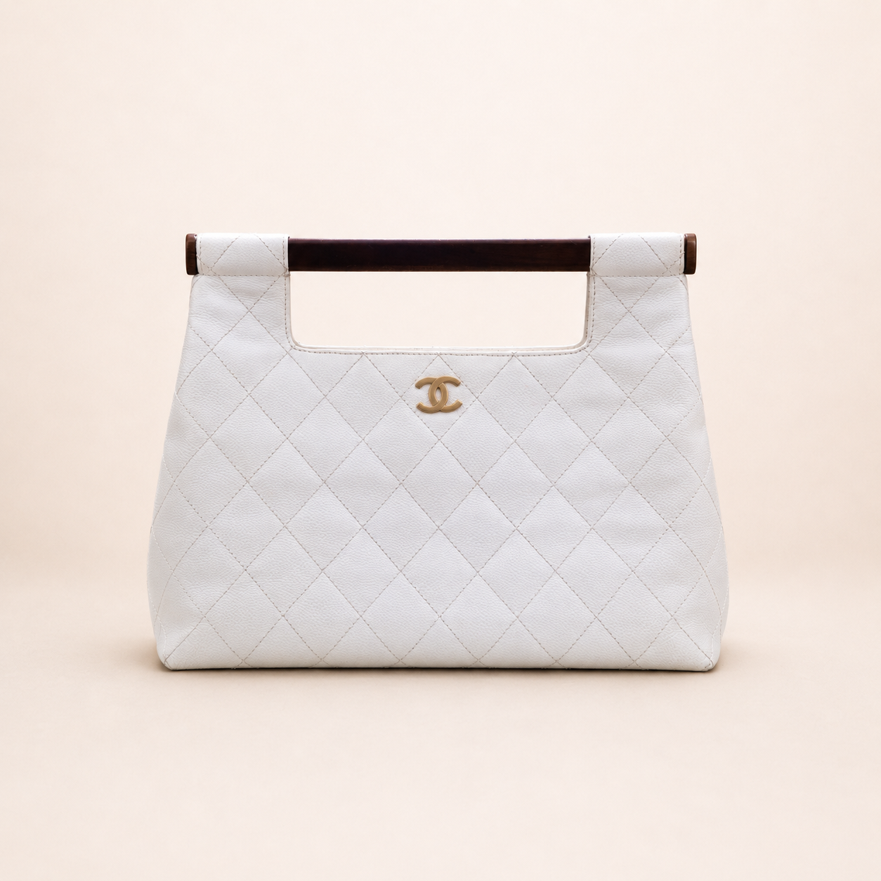 Rare authentic Chanel White Caviar Leather Wood Handle Bag with Matelassé quilting and gold-tone CC logo.