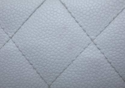 Rare authentic Chanel White Caviar Leather Wood Handle Bag with Matelassé quilting and gold-tone CC logo.