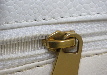 Rare authentic Chanel White Caviar Leather Wood Handle Bag with Matelassé quilting and gold-tone CC logo.