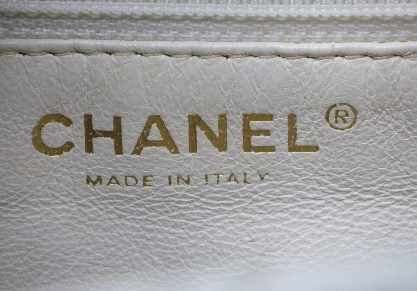 Rare authentic Chanel White Caviar Leather Wood Handle Bag with Matelassé quilting and gold-tone CC logo.