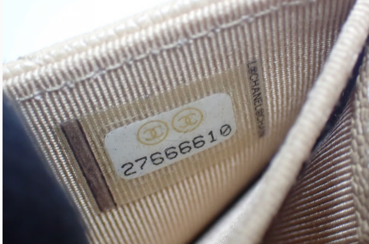 Authentic Chanel Wallet On Chain in beige caviar leather with Matelassé quilting and gold-tone hardware.