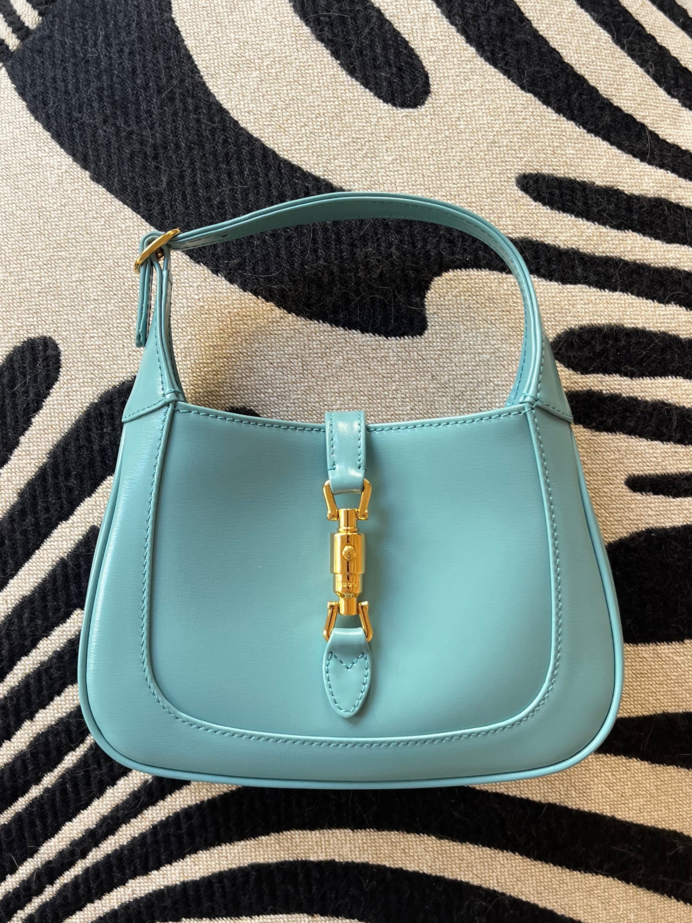 Authentic vintage Gucci Jackie 1961 handbag in turquoise leather with gold-tone hardware