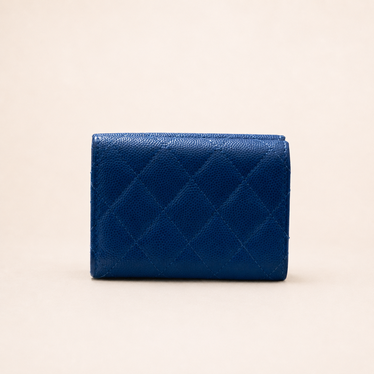 Authentic Vintage Chanel Compact Wallet in blue caviar leather with Matelassé quilting and silver CC logo.