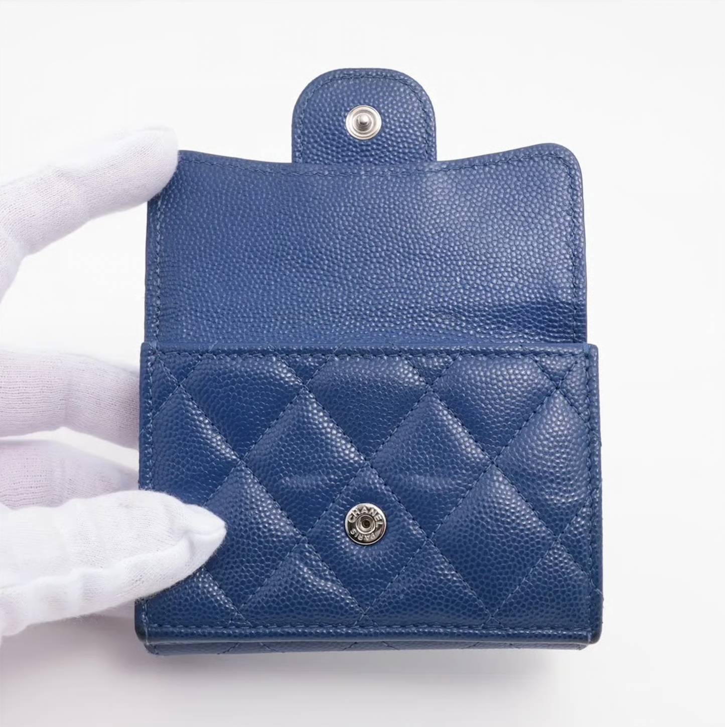 Authentic Vintage Chanel Compact Wallet in blue caviar leather with Matelassé quilting and silver CC logo.