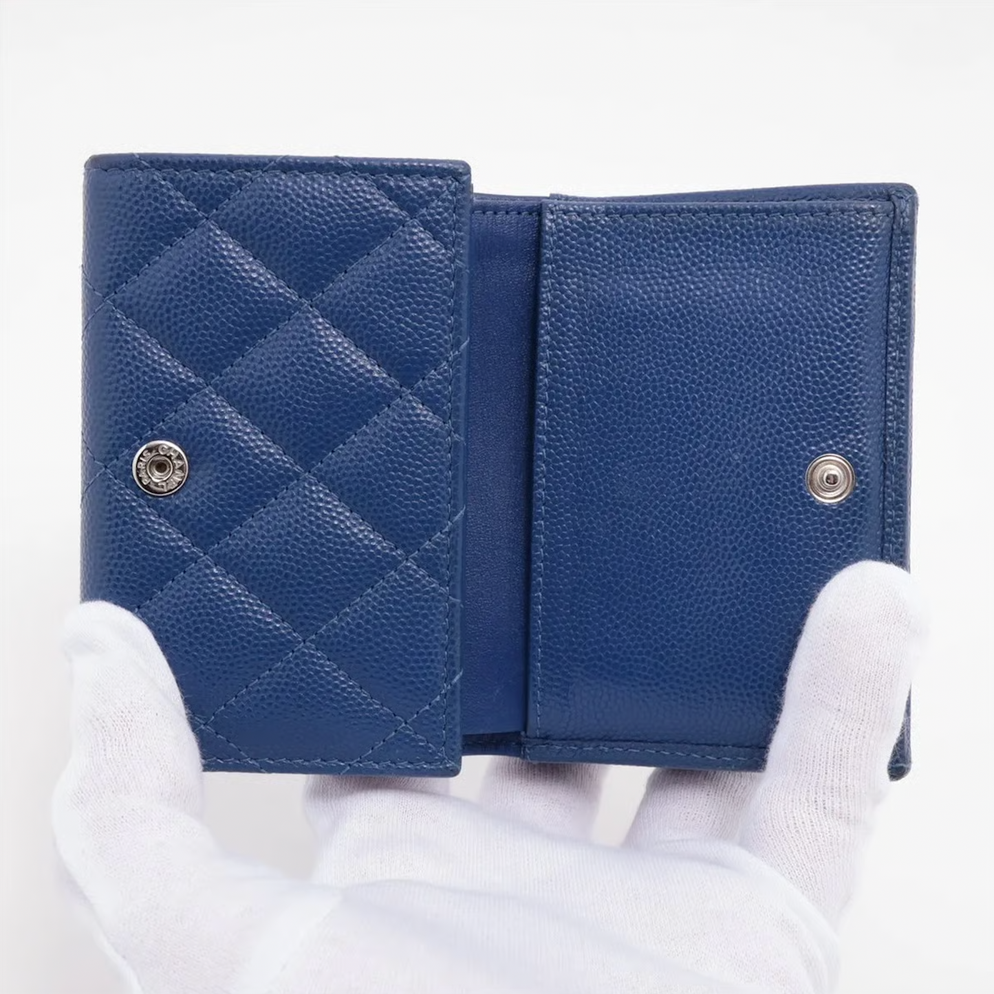 Authentic Vintage Chanel Compact Wallet in blue caviar leather with Matelassé quilting and silver CC logo.