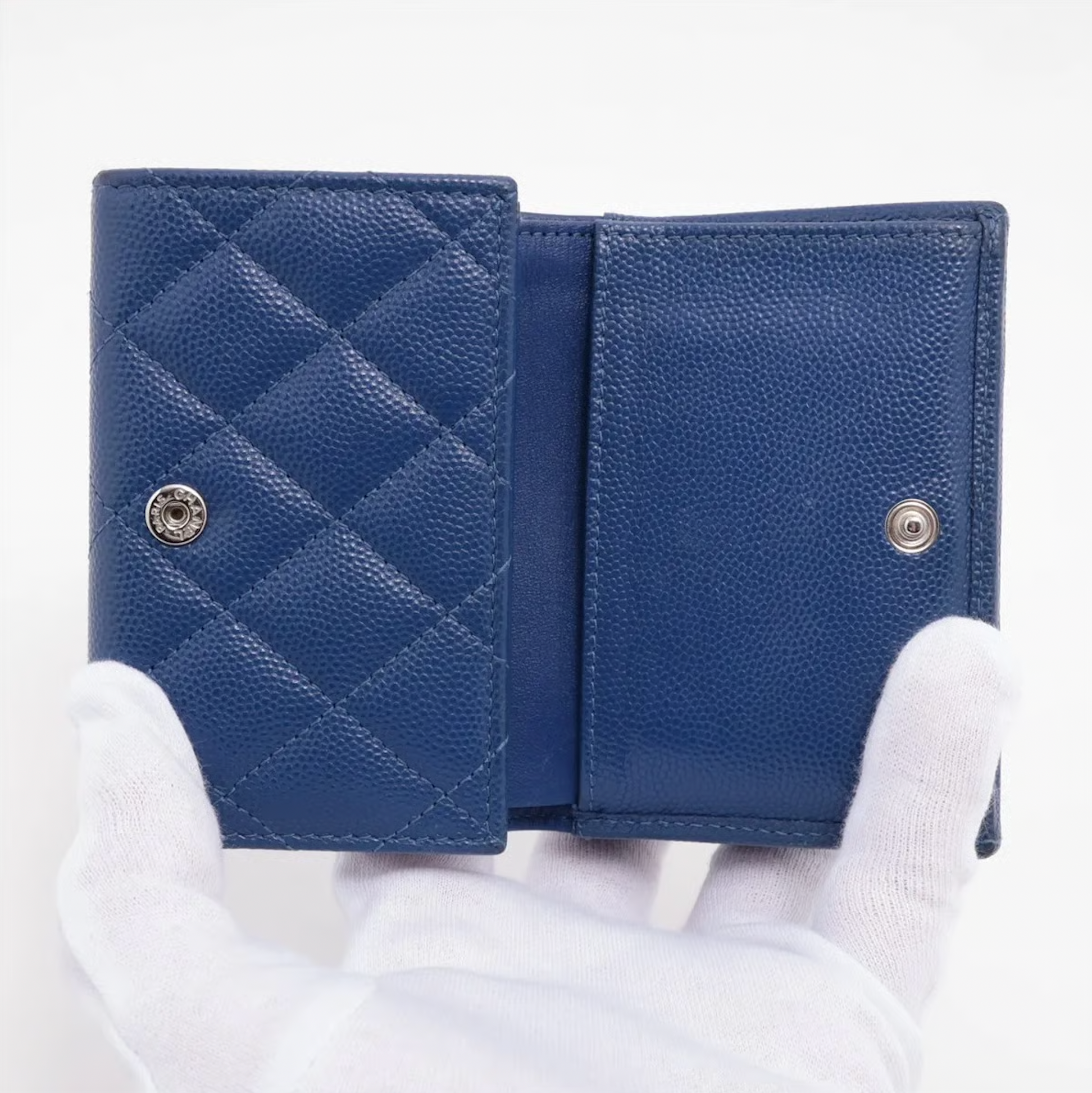 Authentic Vintage Chanel Compact Wallet in blue caviar leather with Matelassé quilting and silver CC logo.