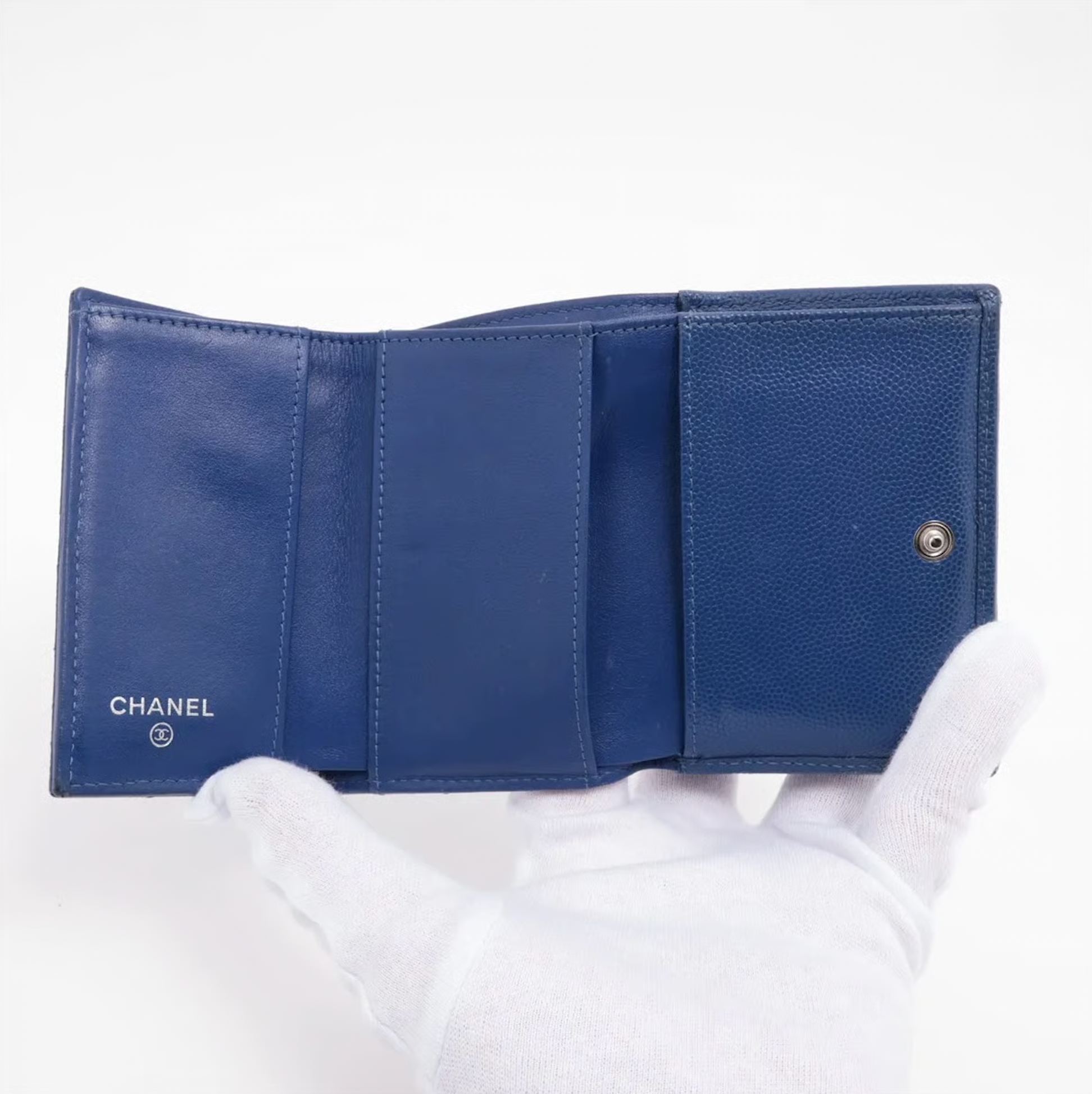 Authentic Vintage Chanel Compact Wallet in blue caviar leather with Matelassé quilting and silver CC logo.