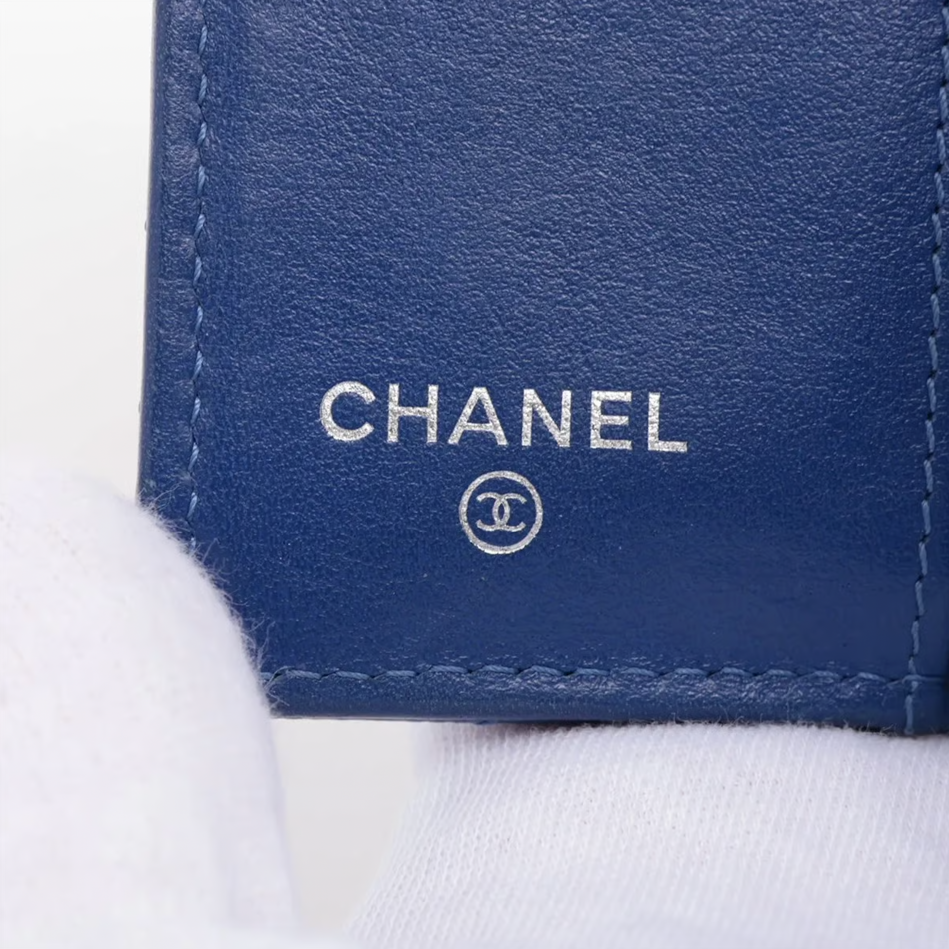 Authentic Vintage Chanel Compact Wallet in blue caviar leather with Matelassé quilting and silver CC logo.