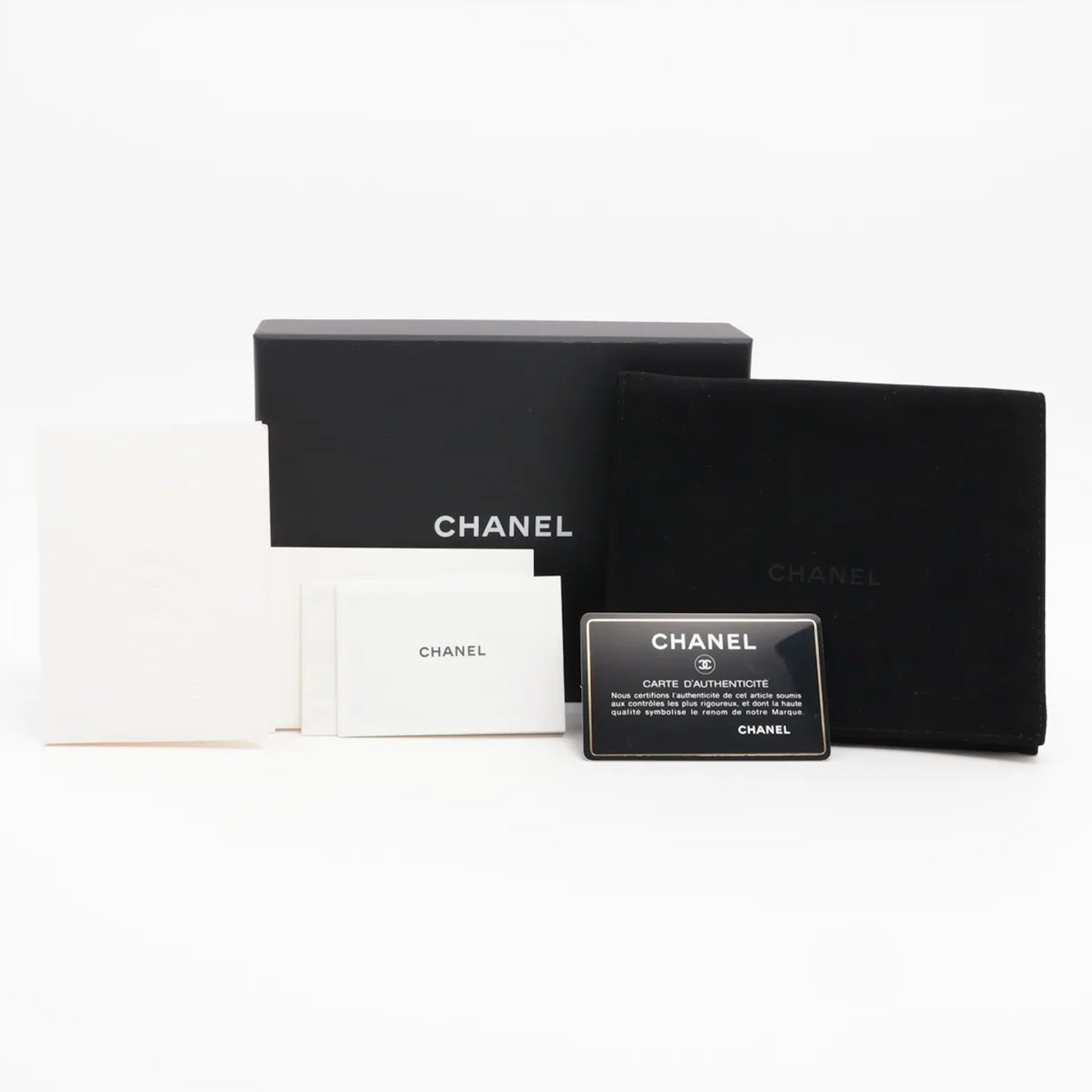 Authentic Vintage Chanel Compact Wallet in blue caviar leather with Matelassé quilting and silver CC logo.