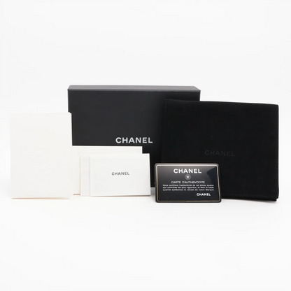 Authentic Vintage Chanel Compact Wallet in blue caviar leather with Matelassé quilting and silver CC logo.