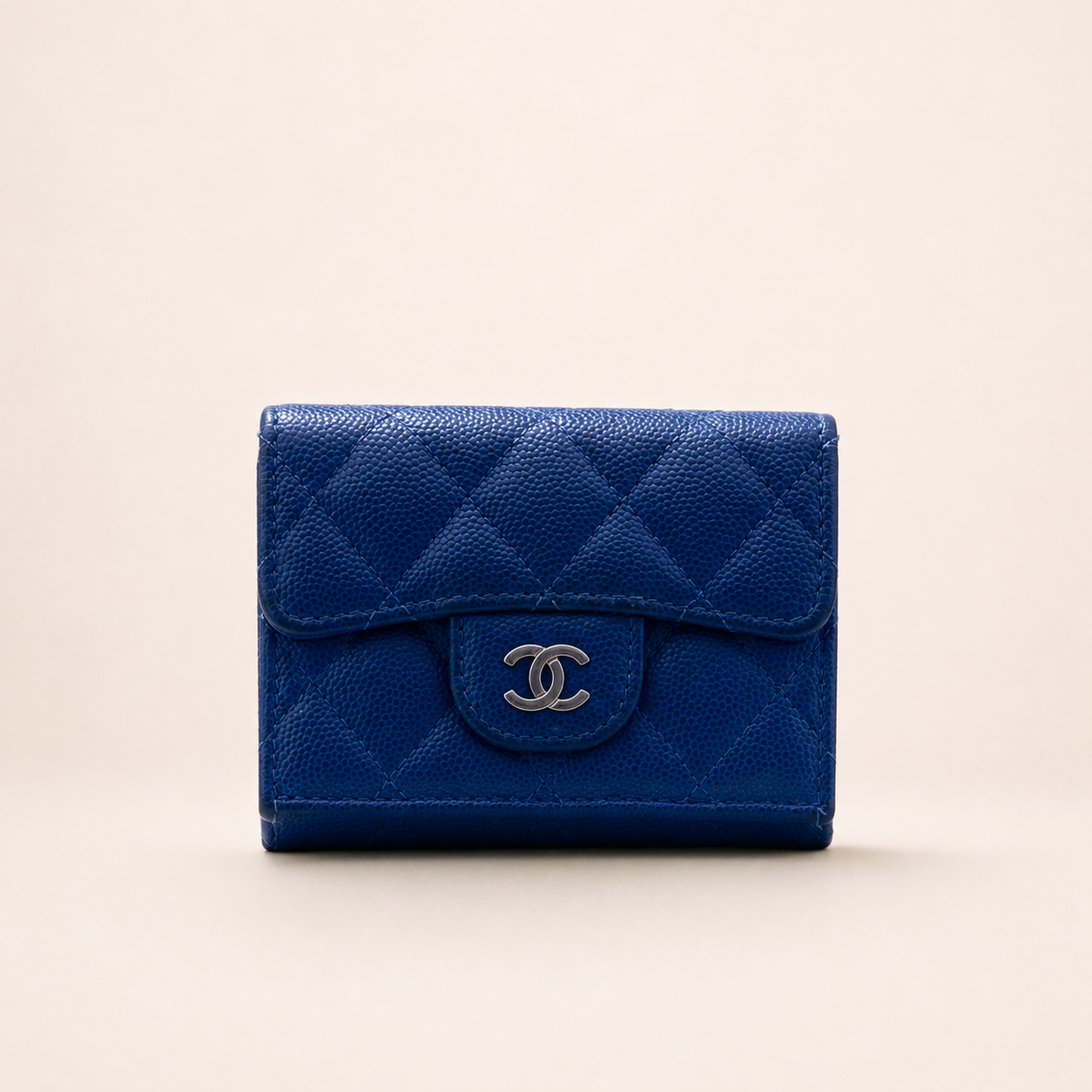 Authentic Vintage Chanel Compact Wallet in blue caviar leather with Matelassé quilting and silver CC logo.