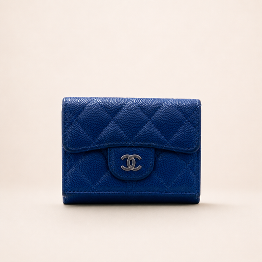 Authentic Vintage Chanel Compact Wallet in blue caviar leather with Matelassé quilting and silver CC logo.