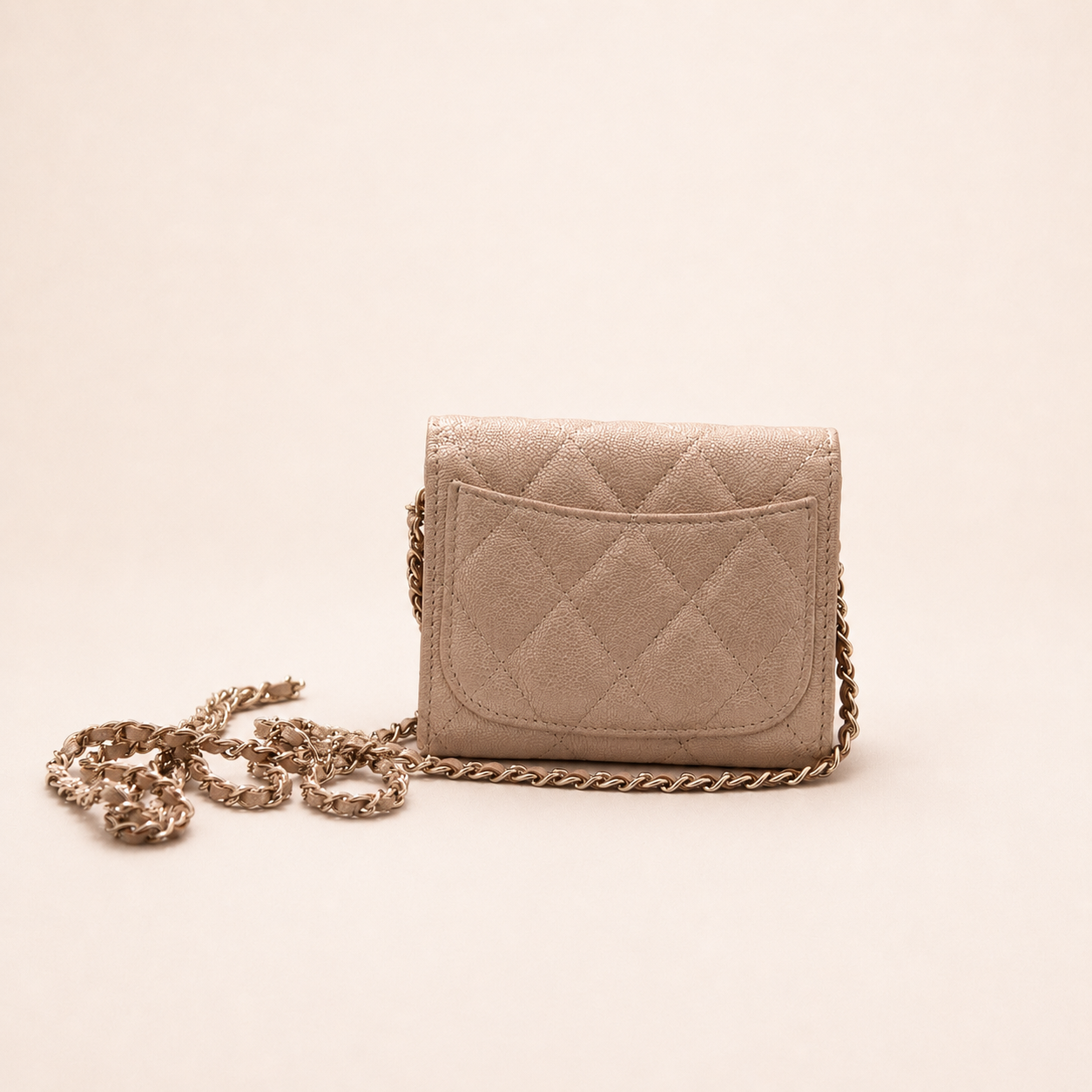 Authentic Chanel Wallet On Chain in beige caviar leather with Matelassé quilting and gold-tone hardware.