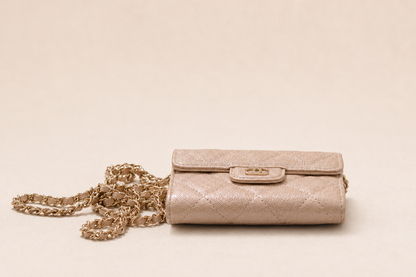 Authentic Chanel Wallet On Chain in beige caviar leather with Matelassé quilting and gold-tone hardware.