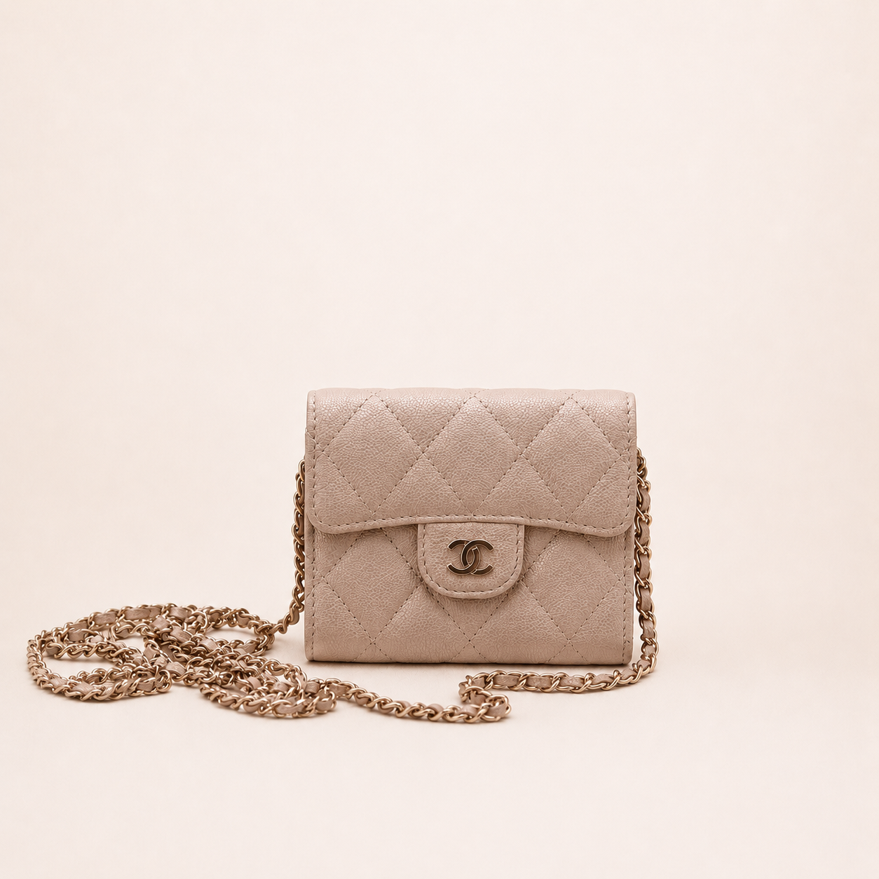 Authentic Chanel Wallet On Chain in beige caviar leather with Matelassé quilting and gold-tone hardware.