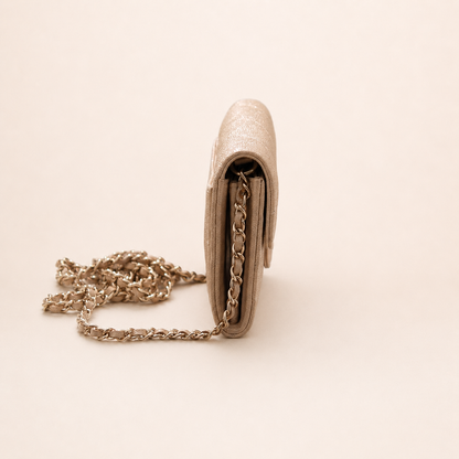 Authentic Chanel Wallet On Chain in beige caviar leather with Matelassé quilting and gold-tone hardware.