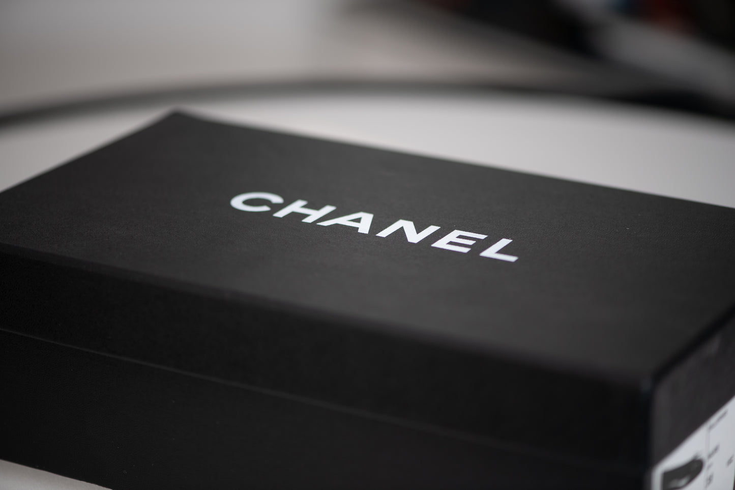 Authentic vintage Chanel Classic Ballerina flats in black leather with patent leather toe caps and CC logo