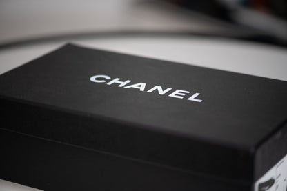 Authentic vintage Chanel Classic Ballerina flats in black leather with patent leather toe caps and CC logo
